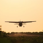 small plane landing at Dangriga Air Strip