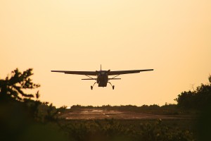 small plane landing at Dangriga Air Strip