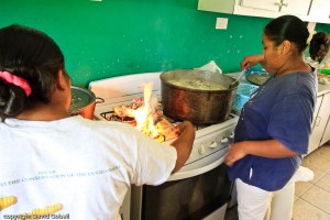 Belizean women preparing some "boil up", and favorite food in Belize