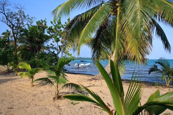 private boat on prime beachfront Belize real estate